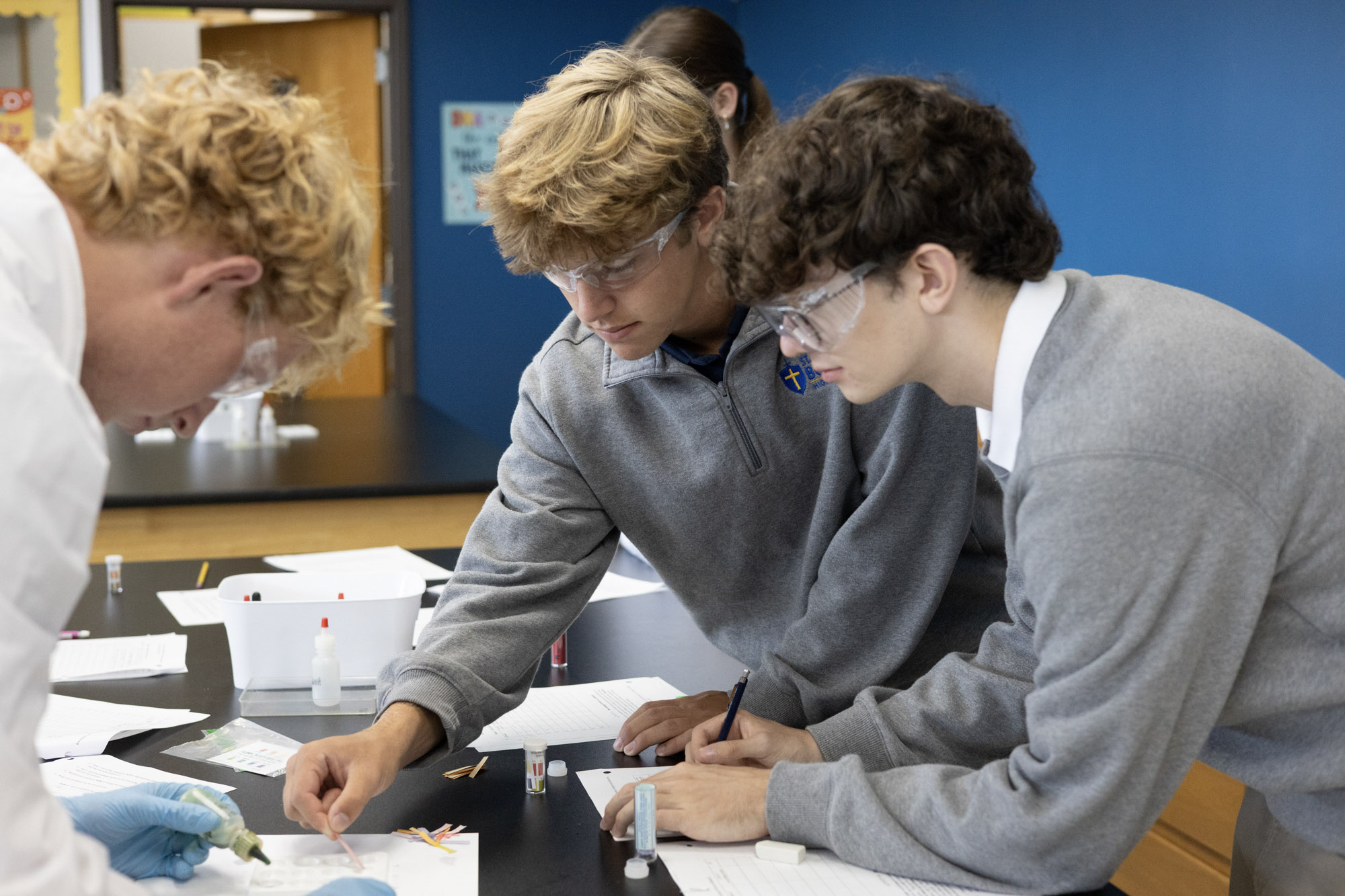 Three students working on a group activity