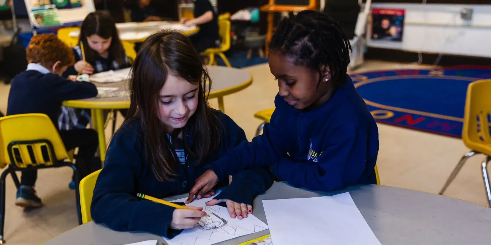 Teacher and student working together.