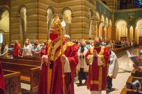 Archbishop Rozanski processes down the Cathedral Basilica aisle to celebrate the Mass of Catechetical Commissioning. Photo Credit: Katherine Blanner