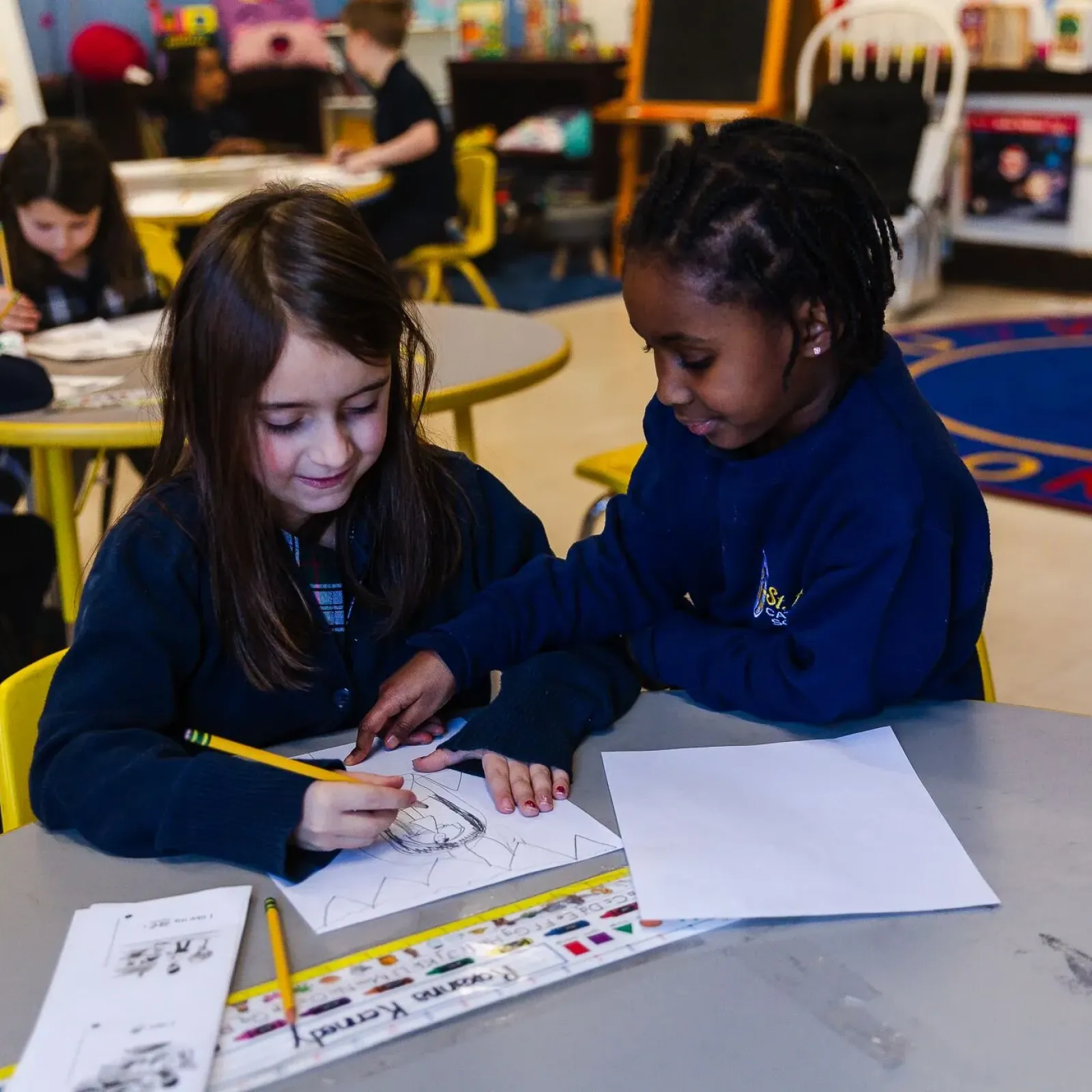 Teacher and student working together.