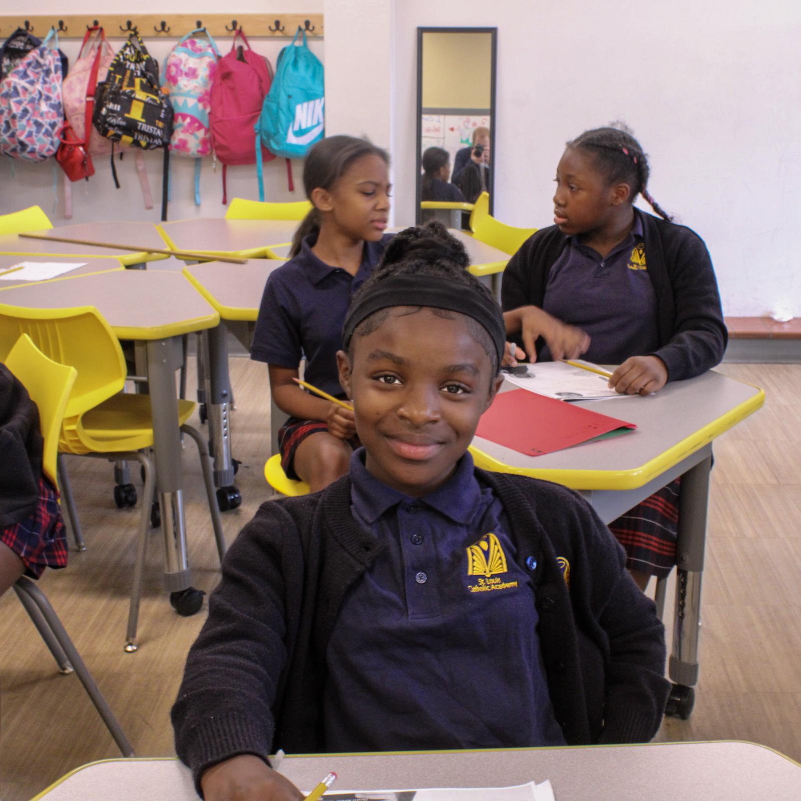 Smiling student at desk